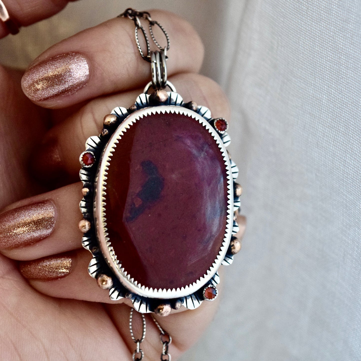 The Lion House Worry Stone Pendant with Red Jasper, Garnet, and Yellow Gold Fill