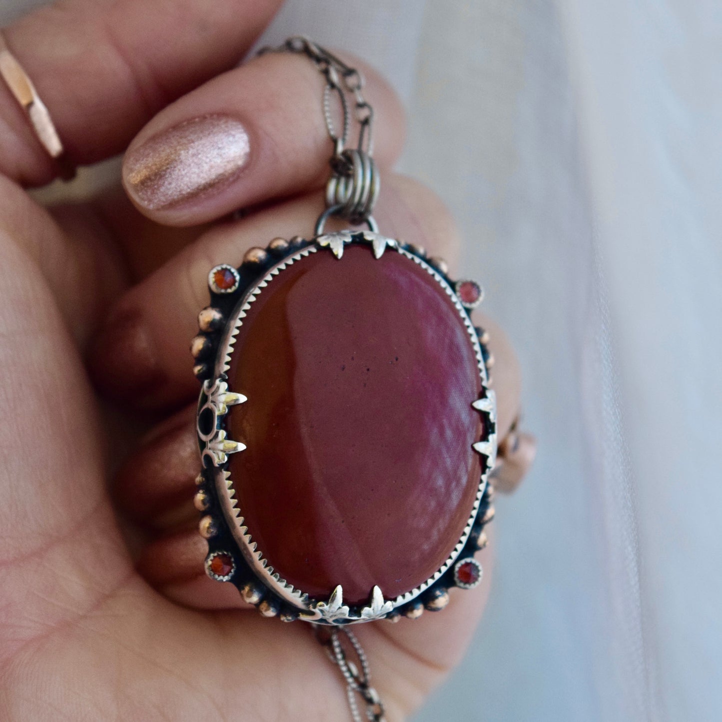 The Lion House Worry Stone Pendant with Red Jasper, Garnet, and Yellow Gold Fill